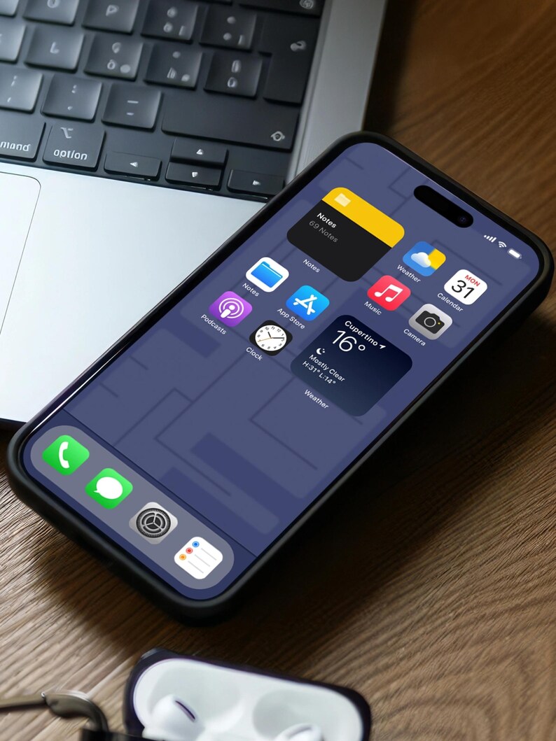 May include: A black smartphone with a dark blue screen displaying various app icons, including Notes, Weather, Calendar, Music, Camera, Podcasts, Clock, and App Store. The phone is on a wooden surface with a laptop and a pair of white earbuds in the background.
