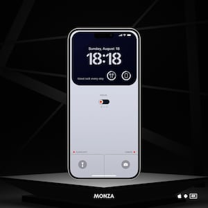 May include: A white smartphone with a black screen displaying the time 18:18, the date Sunday, August 18, and the text "Good luck every day". The phone also has icons for headphones, a phone, and a flashlight. The phone is on a black surface with the word "MONZA" and a 4K logo.