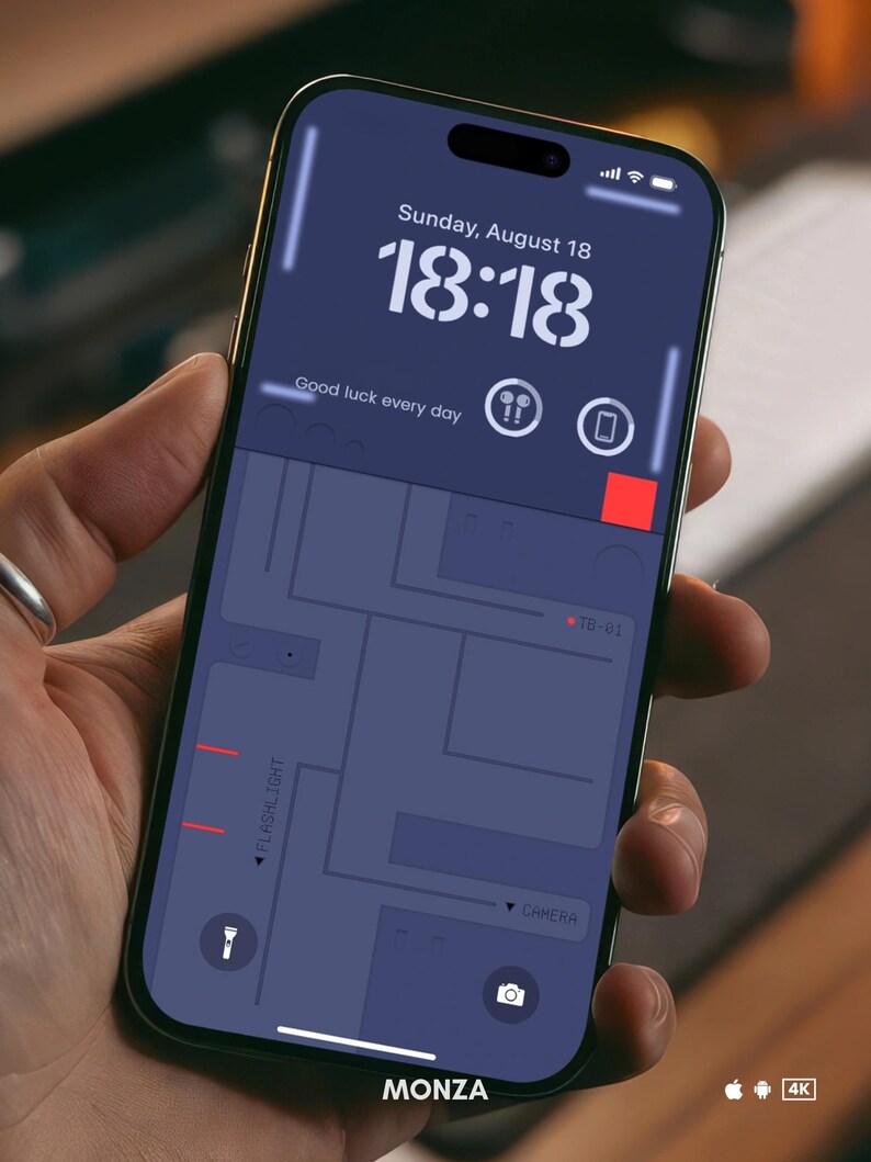 May include: A smartphone displaying a map with the word "MONZA" at the bottom. The time is 18:18 and the date is Sunday, August 18. The phone has a flashlight and camera icon at the bottom.