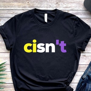 May include: Black t-shirt with the text "cisn't" in yellow and purple letters.