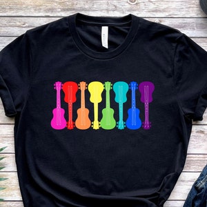 LGBTQ Unisex T-shirt - Rainbow Flag Guitars - Musician Present - LGBTQIA+ Pride Month - Genderfluid, Demisexual, Aromantic Music Gift