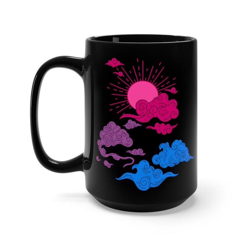 May include: A black ceramic mug with a bi-pride flag themed design. The design features a pink, blue, and purple sun with clouds in the same colors.