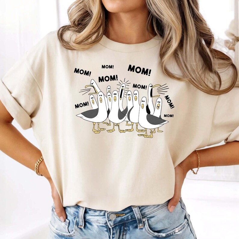 May include: A set of three ceramic mugs with a speckled, matte finish. The mugs are in shades of cream, light gray, and dark gray. Each mug has a simple, minimalist design and a rounded handle.