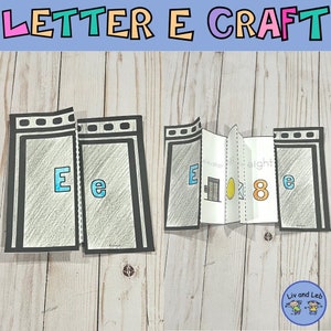 May include: A printable letter E craft activity for children. The craft features a black and white illustration of a lift, an egg, and the number 8. The words "elevator", "egg", and "eight" are written on the craft.