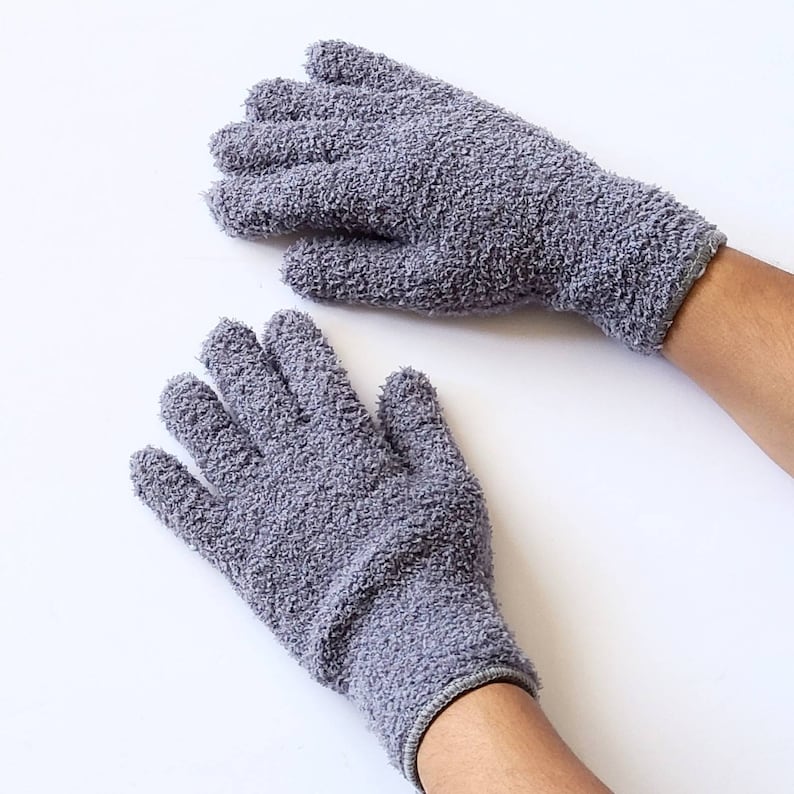May include: A pair of gray terrycloth gloves. The gloves are made of a soft, absorbent material and are perfect for cleaning or doing chores.