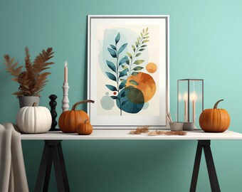 May include: A white table with a framed abstract print of blue and orange leaves, two black candle holders, three pumpkins, and a brown plant in a white pot.