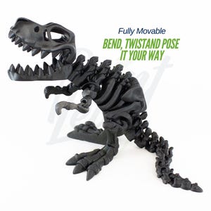 May include: A fully articulated black plastic dinosaur skeleton toy. The toy is posed in a standing position with its mouth open. The text "Fully Movable BEND, TWIST AND POSE IT YOUR WAY" is printed on a white background above the toy.