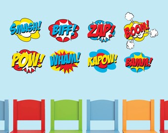 May include: Eight colorful comic book style speech bubbles with words like "POW!" and "BAM!" on a blue wall with four colorful chairs in front of them.