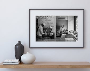 May include: Black and white photograph of a bakery interior. Two people are working behind the counter, one is making coffee and the other is arranging pastries. The sign above the counter reads "Caffe", "Senza Caffeina", and "Brioche".