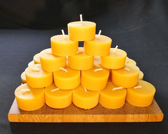 30 | 60 | 85 bijenwas waxinelichtjes, naturel, met of zonder brandschaaltje, verpakt per set van 30/25 stuks.