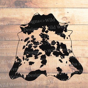 May include: Black and white cowhide rug with a distressed, vintage look. The rug has a unique, irregular shape and is perfect for adding a rustic touch to any room.