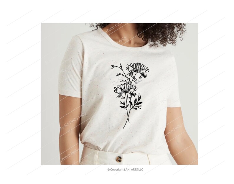 May include: A white t-shirt with a black line drawing of a bouquet of flowers. The flowers are stylized and have a simple, minimalist design.