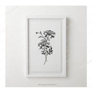 May include: A black and white line drawing of a bouquet of flowers in a white frame. The flowers are stylized and have a simple, elegant design. The frame is on a white wall.