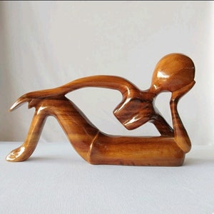 Handcrafted wooden sculpture abstract thinker