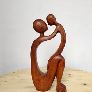 Hand carved mother and child natural wood sculpture