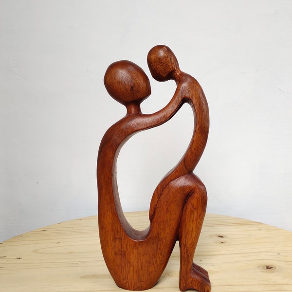 Hand carved mother and child natural wood sculpture