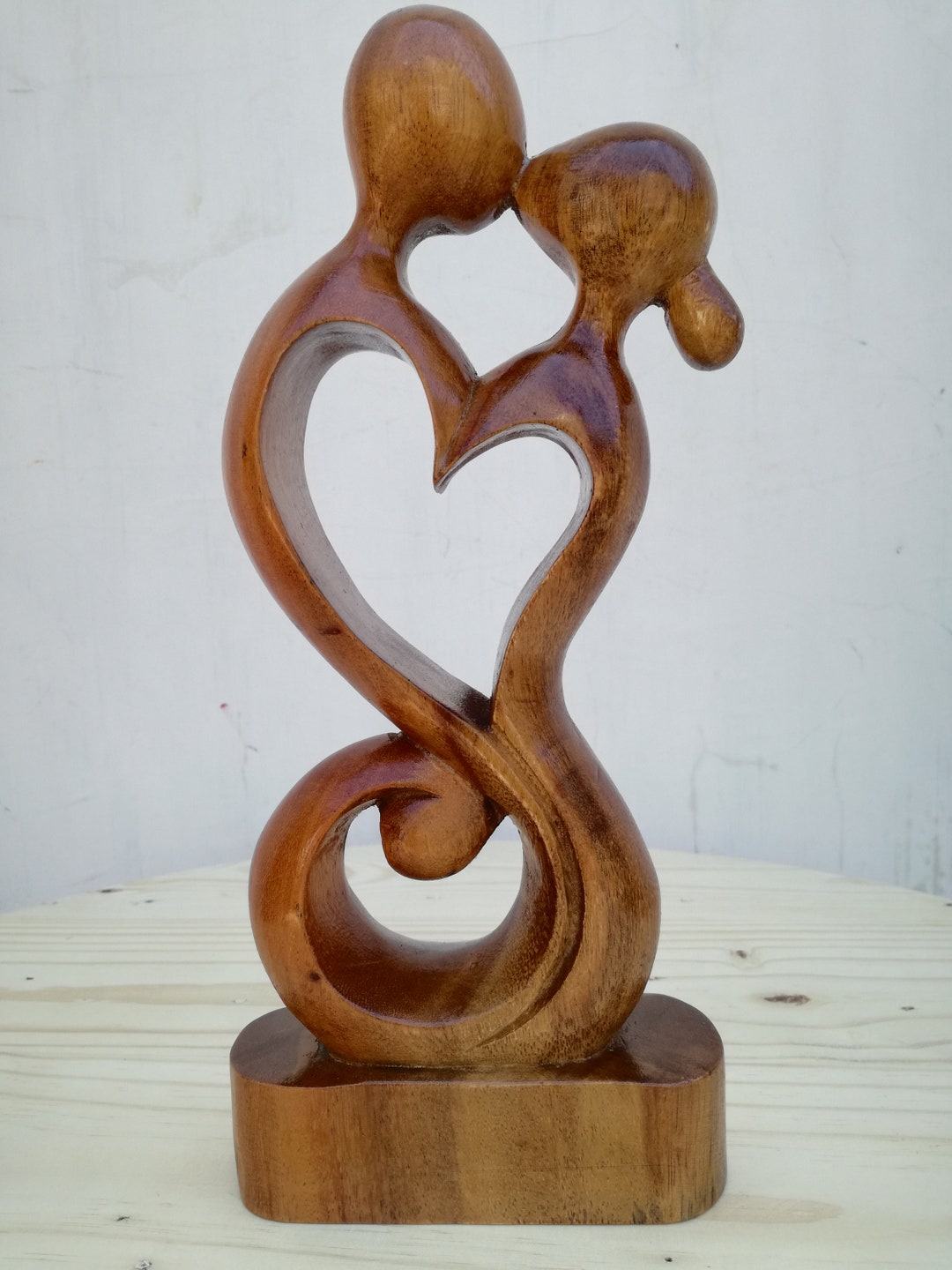 Signed Wood Sculpture of Heart in Hands, 'Giving Love