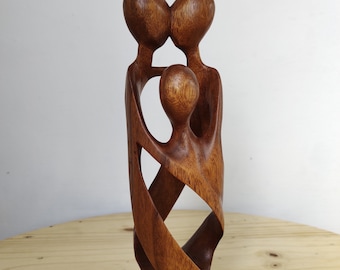 Hand crafted wood family  statue” happy family”