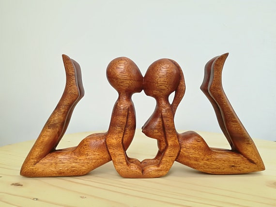 Kissing couple abstract wood sculpture