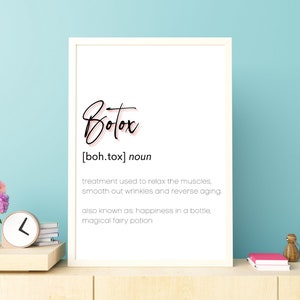 May include: A white framed print with the word "Botox" in black script with a pink outline. The definition of Botox is written below in black text: "[boh.tox] noun treatment used to relax the muscles, smooth out wrinkles and reverse aging. also known as: happiness in a bottle, magical fairy potion"