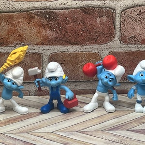 4 Smurf Figurines