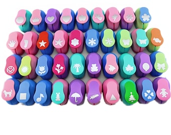 May include: A set of 36 colorful plastic paper punchers with various shapes, including stars, hearts, flowers, animals, and geometric shapes.