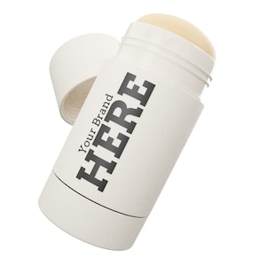 Può includere: Stick di deodorante bianco con meccanismo a rotazione. L'etichetta dice "HERE" con il testo "Your Brand" sotto.