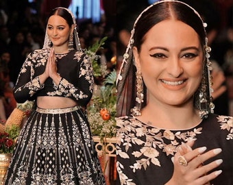 Beau lehenga de Sonakshi par Sabyasachi avec une broderie épaisse de couleur noire avec un travail de broderie en dupatta et un chemisier pour un look royal parfait