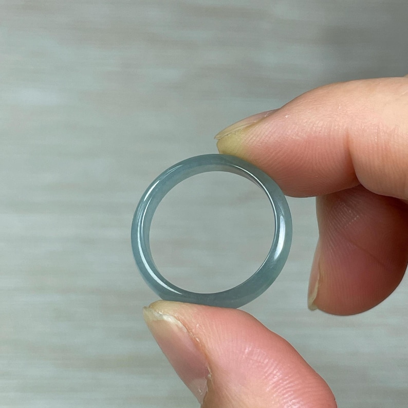 real icy green jade ring, engraving applied on both sides of the ring