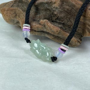 icy green jade bracelet, lotus flower pattern shown on the both side of jade.  top quality jadeite jewelry