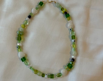 Green trendy beaded necklace with glass beads and acrylic beads