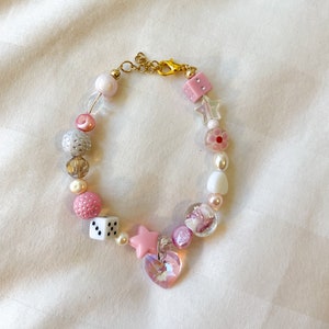 Pink + white trendy beaded bracelet with lamp-worked glass beads, freshwater pearls, and acrylic beads and pearls
