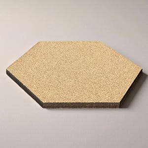 May include: A hexagonal cork board with a black border. The cork board is made of natural cork and has a slightly textured surface.