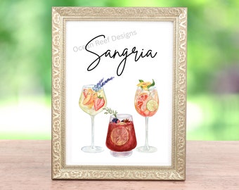 May include: A printable sign with the text "Ocean Reef Designs Sangria" in black cursive font. The sign features three watercolor illustrations of glasses of sangria with various fruits and garnishes.
