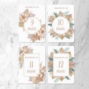 May include: Four white cards with brown and green floral designs. Each card has a different number from 9 to 12 with the word 'mois' below it. The text on each card reads 'Aujourd'hui j'ai'.