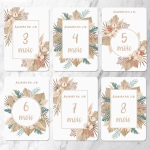 May include: Six printable cards with a neutral color scheme. Each card has a number from 3 to 8 with the word 'mois' underneath. The cards are decorated with a floral design featuring beige, brown, and green colors. The text on each card reads 'Aujourd'hui j'ai'.