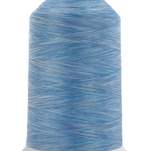 May include: A spool of light blue thread with white streaks, wound on a white plastic bobbin.