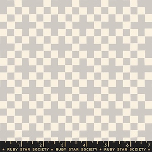 May include: A fabric swatch featuring a repeating geometric pattern of light gray crosses on a cream background. A black ruler at the bottom shows a scale of 7 inches, with the text RUBY STAR SOCIETY printed repeatedly along the edge.