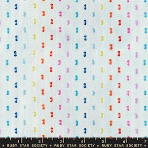 May include: White fabric with a repeating pattern of colorful, vertical dashes in shades of blue, orange, pink, yellow, and purple. The fabric has a textured appearance and is suitable for various sewing projects.