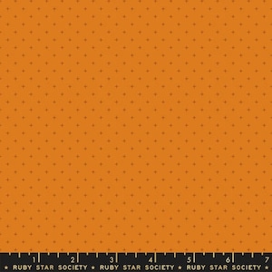 May include: A seamless fabric pattern with a repeating pattern of small black plus signs on a solid orange background. The fabric is from Ruby Star Society.