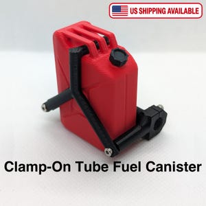 May include: A red 3D-printed fuel canister with a black cap and a black clamp-on mounting bracket attached to the side. The object features a textured surface and includes the text Clamp-On Tube Fuel Canister at the bottom of the frame.