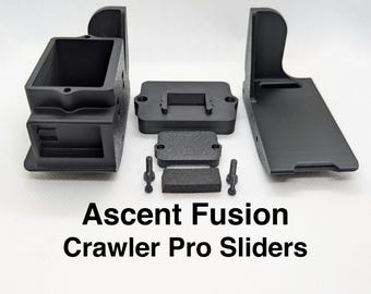 May include: Black plastic parts for an Ascent Fusion Crawler Pro Slider. The parts include a box, a plate with a slot, a small rectangular piece, and two long pieces.