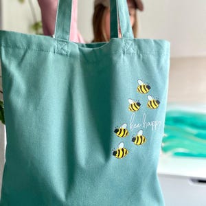 Minimalist cotton tote bag printed with bees in sage green and many other colors | Organic cotton shopping bag with insects bee happy Sage Green