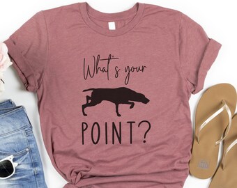 May include: A mauve t-shirt with the text "What's your POINT?" and a silhouette of a dog pointing.
