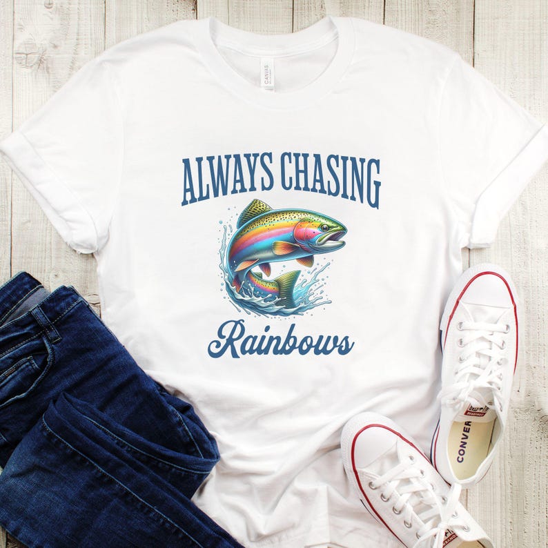 May include: White t-shirt with the text "Always Chasing Rainbows" and a rainbow trout illustration.