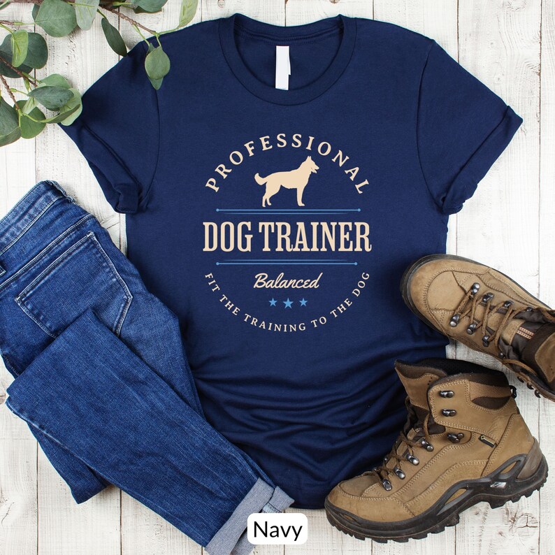 Balanced Dog Trainer T-Shirt: Fit the Training to the Dog. With a vintage style and handsome Belgian Malinois silhouette, its the perfect dog training apparel wear to appointments and lessons. And it makes a classy Malinois dog trainer gift!