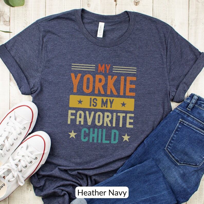 Funny Yorkshire Terrier T-Shirt - My Yorkie Is My Favorite Child. Looking for a cute gift for a Yorkie lover? This funny tee will be sure to bring a smile! Its perfect for the Yorkie dog mom or dad who considers their dog their favorite child.