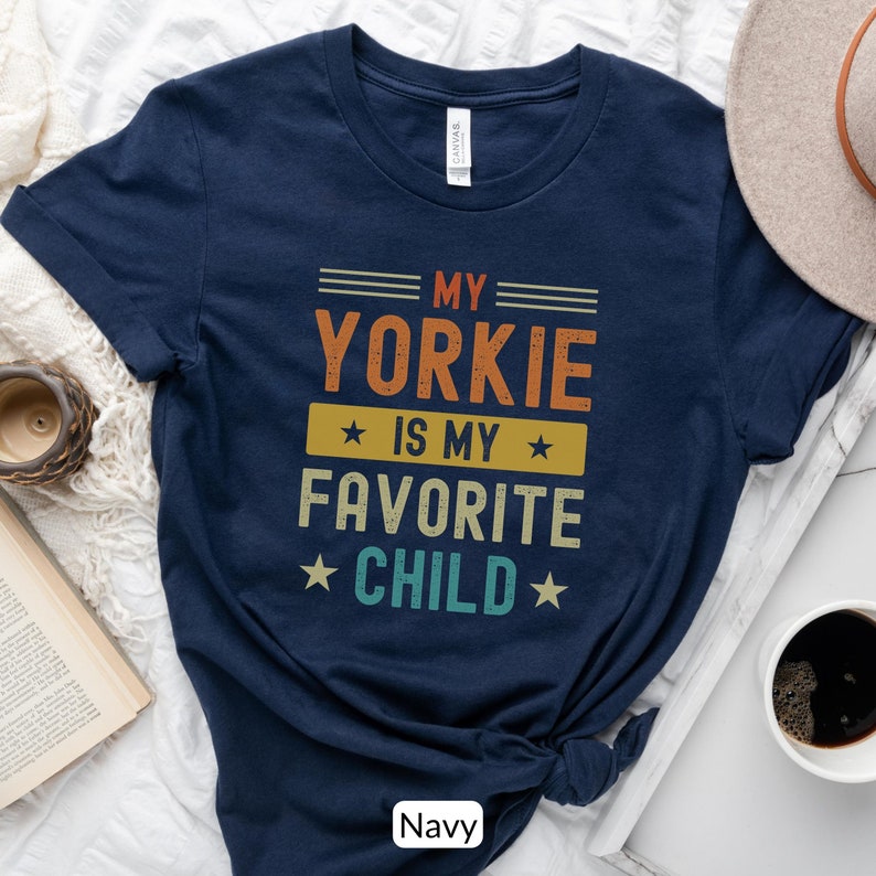 Funny Yorkshire Terrier T-Shirt - My Yorkie Is My Favorite Child. Looking for a cute gift for a Yorkie lover? This funny tee will be sure to bring a smile! Its perfect for the Yorkie dog mom or dad who considers their dog their favorite child.