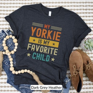 Funny Yorkshire Terrier T-Shirt - My Yorkie Is My Favorite Child. Looking for a cute gift for a Yorkie lover? This funny tee will be sure to bring a smile! Its perfect for the Yorkie dog mom or dad who considers their dog their favorite child.