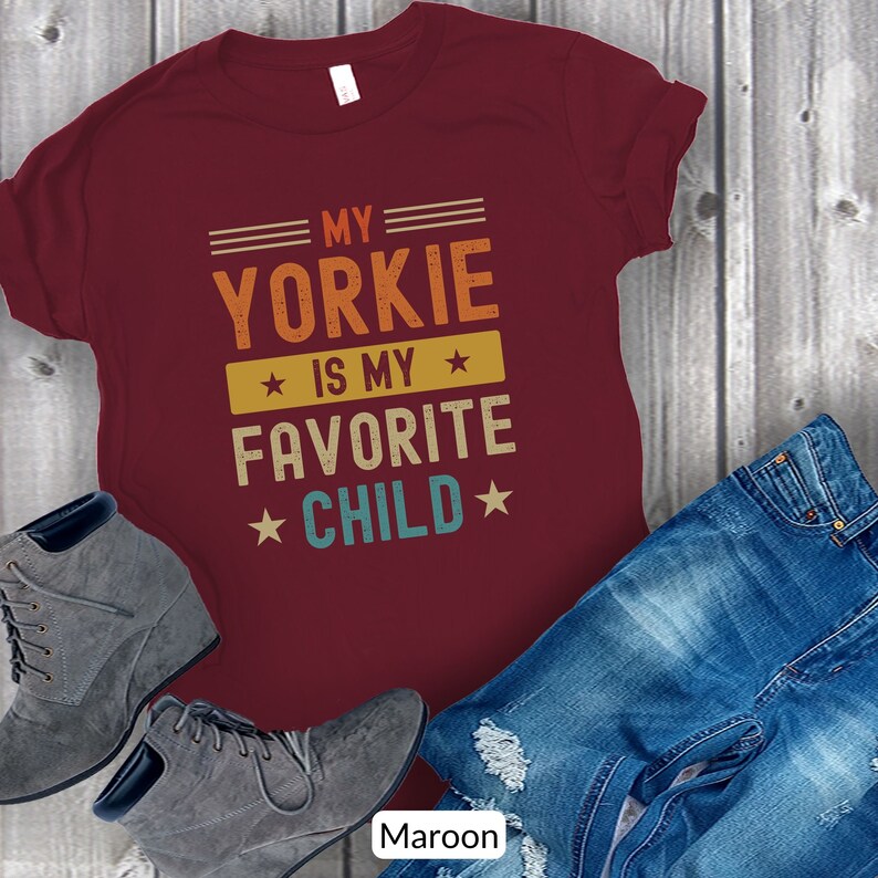 Funny Yorkshire Terrier T-Shirt - My Yorkie Is My Favorite Child. Looking for a cute gift for a Yorkie lover? This funny tee will be sure to bring a smile! Its perfect for the Yorkie dog mom or dad who considers their dog their favorite child.